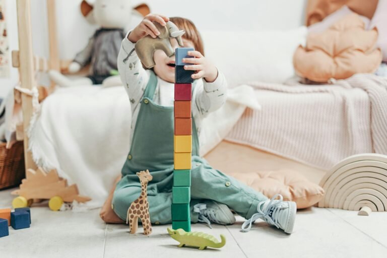 A young child engaged in creative play with colorful wooden blocks indoors.